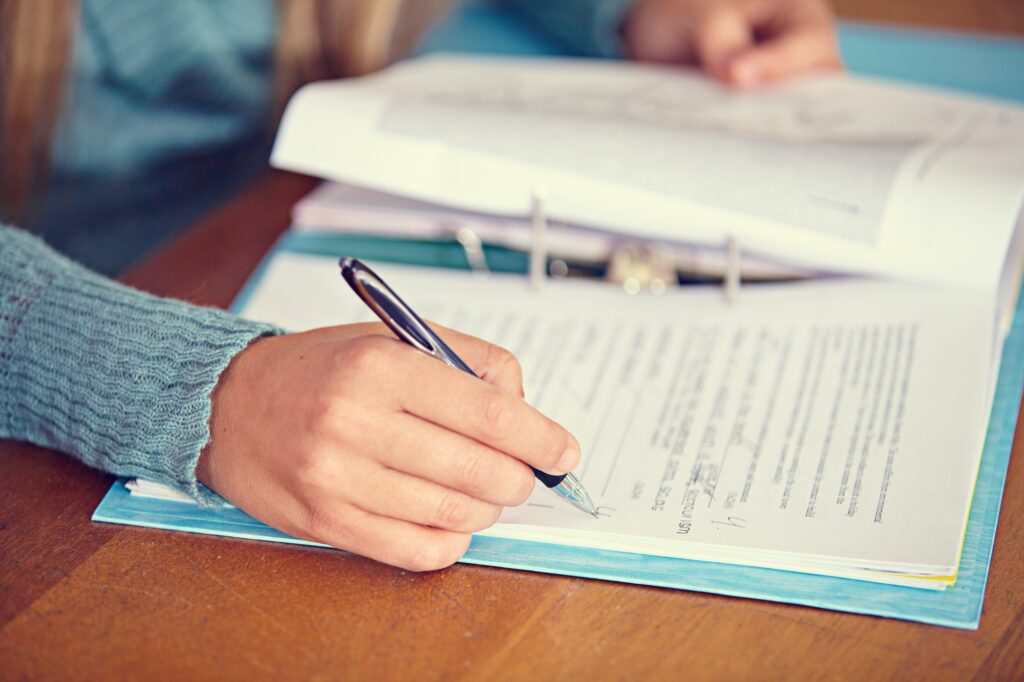Continual assessment is crucial. Closeup shot of a teacher marking a test.